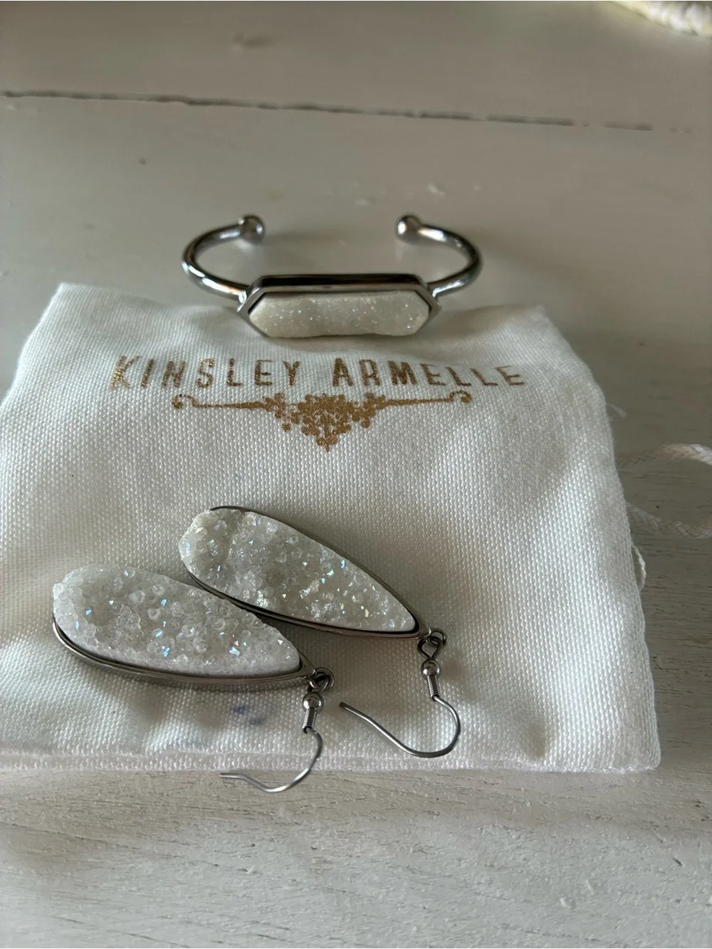 Kinsley Armelle White Druzy Teardrop Earrings and matching silver tone bracelet